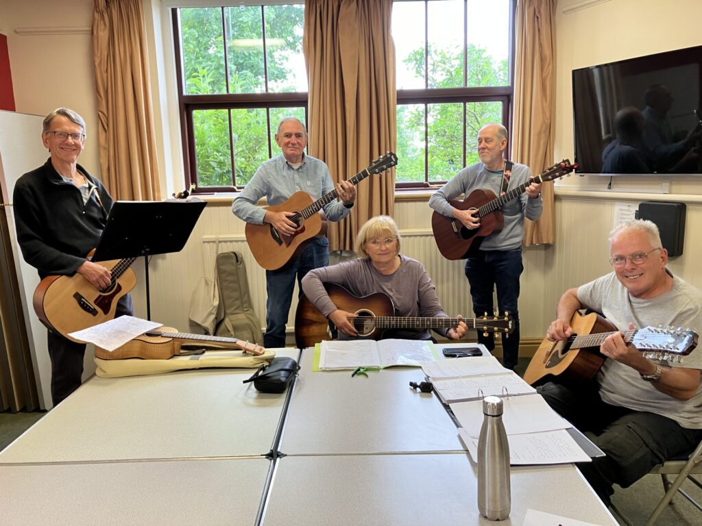 Five Guitar Players with their instruments at The Old School, Williams Room.