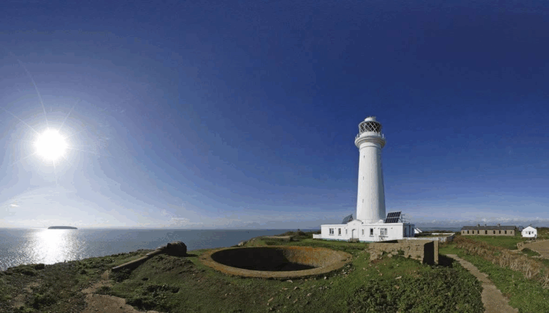 Lighthouse on Flat Holm with Sun to left of frame