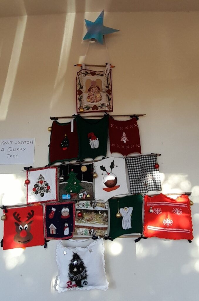 A "Christmas Tree" made from decorated squares of various materials and decorations.